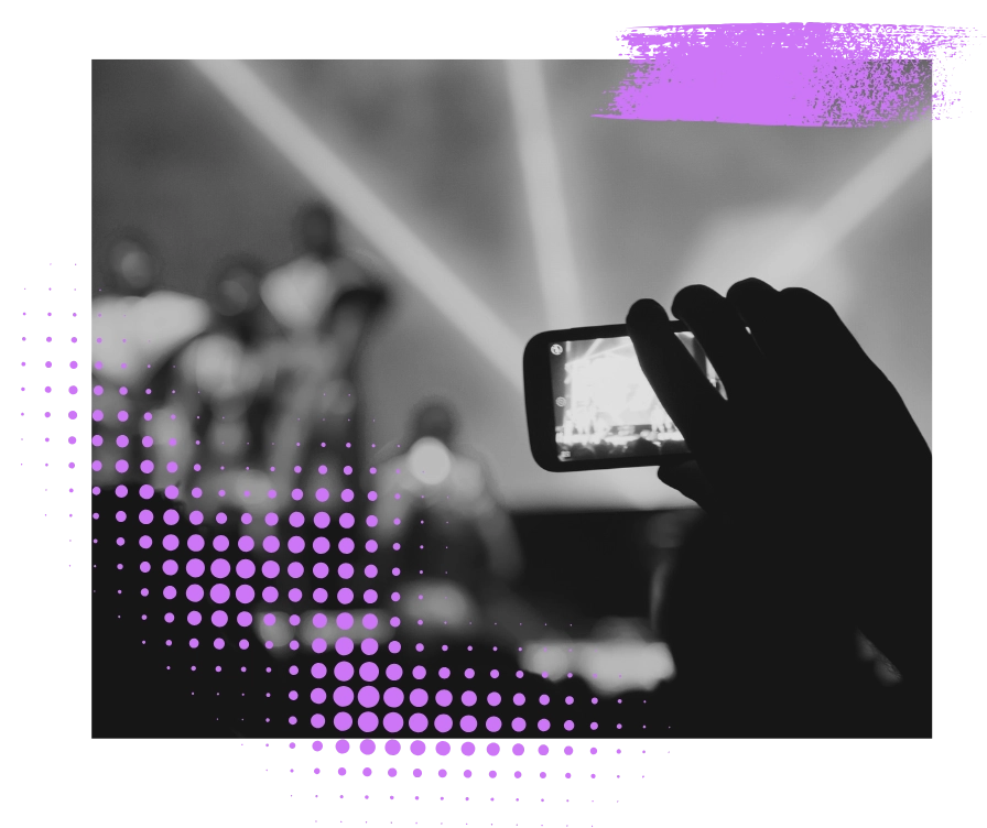 Fan filming concert with phone